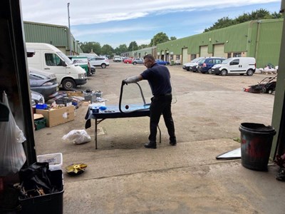 Tony Green prepares the windscreen for a Morris Marina